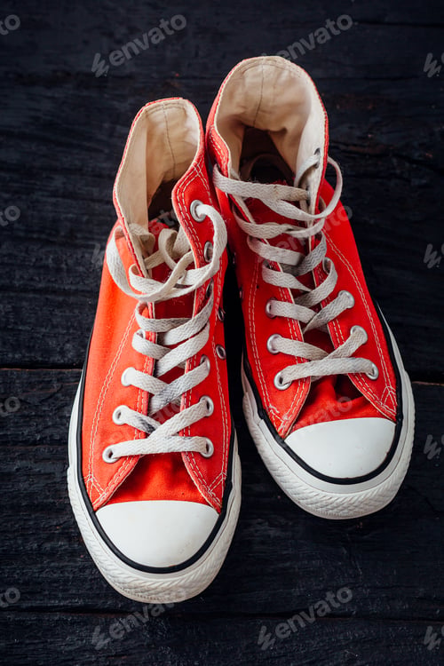 Preview: Red Sneaker On Black Wooden Background