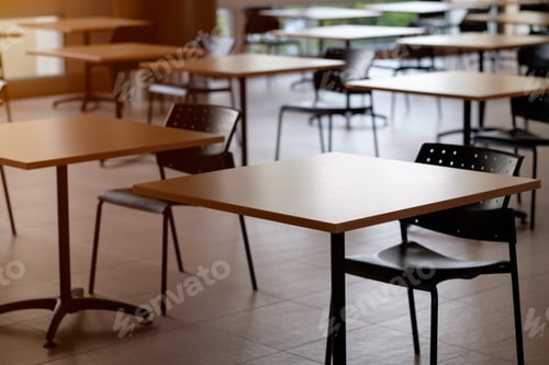 Preview: Tables And Chairs That Is Arranged Spaced Or Social Distancing In The Dining Room Without People.