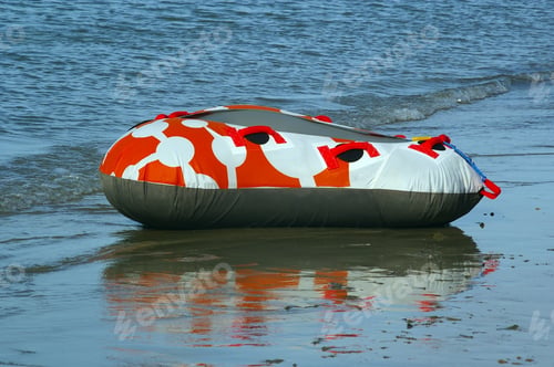 Preview: Orange Inner Tube On Beach Edge Ready For Action