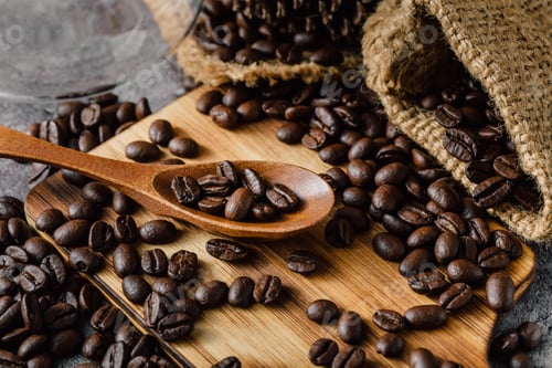 Preview: Roasted Coffee Beans and Spoon on Wooden Board