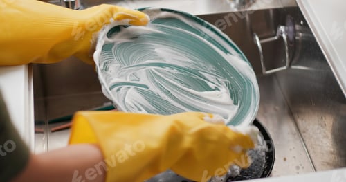 Preview: Wash Dishes In Kitchen At Home