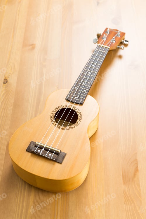 Preview: Ukulele On Wood Background