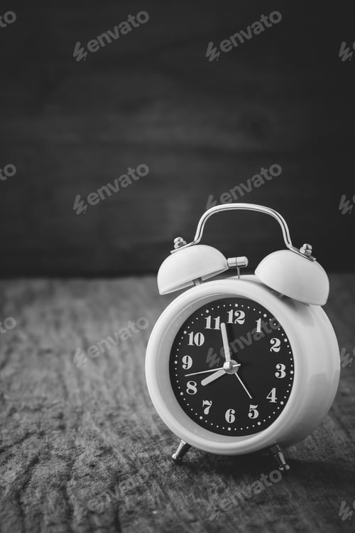 Preview: White Alarm Clock On Wooden Table ,Monochrome Filter