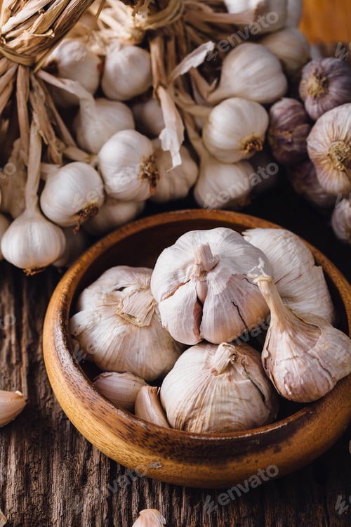 Preview: Garlic On Wooden Table Background