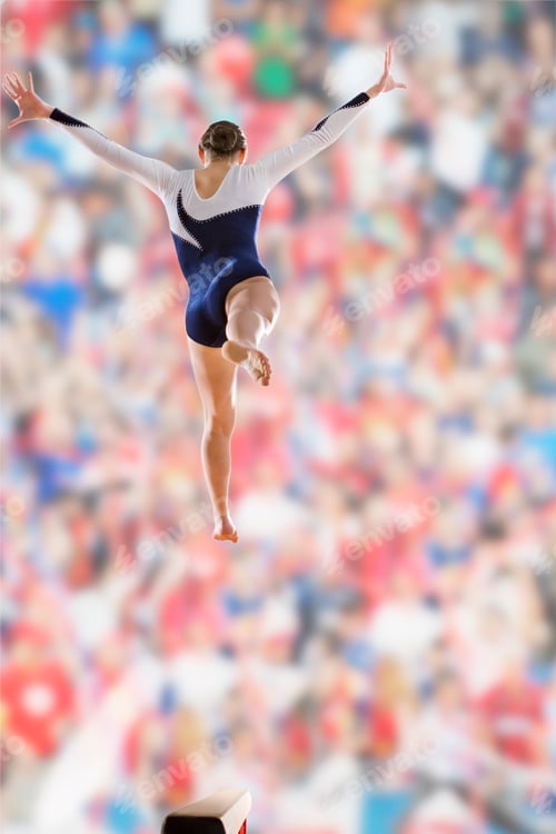 Preview: Female Gymnast Jumping On Balance Beam With Crowd Watching