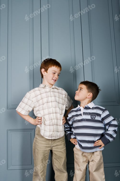 Preview: Younger Boy Staring Up At Older Boy