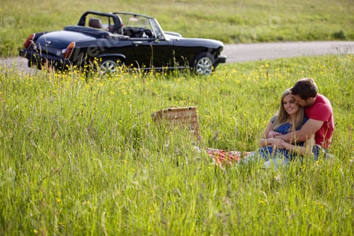 Preview: A Young Couple Having A Picnic In Summertime
