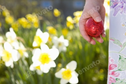 Preview: Girl Finding Chocolate Easter Eggs In Flowers