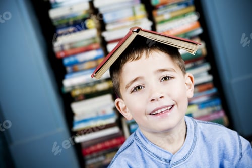 Preview: Little Boy With Book On His Head