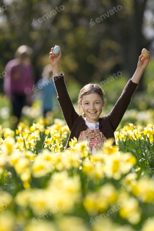 Preview: Young Girl Finding Easter Eggs In Field Of Daffodils