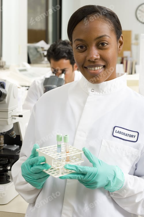 Preview: Female Laboratory Technician With Test Tubes, Smiling, Portrait