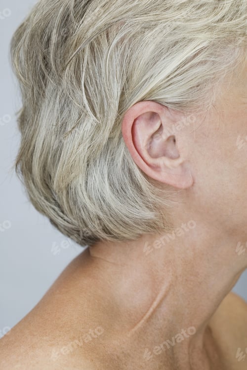 Preview: A Portrait Of A Senior Woman Showing Her Right Ear And Neck