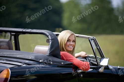 Preview: A Young Woman Driving A Black Sports Car