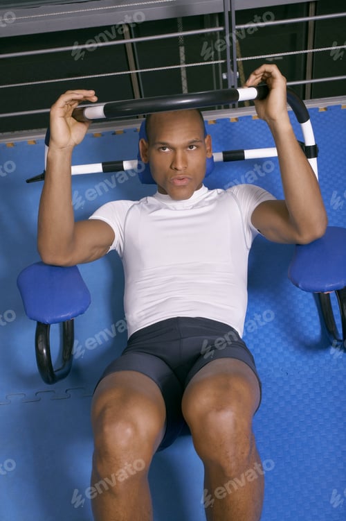 Preview: Man Exercising At A Gym.