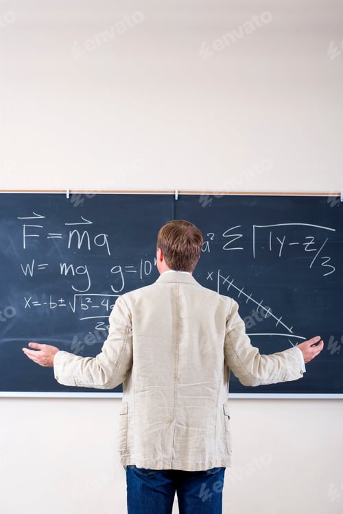 Preview: Male Teacher Writing Math Problem On Blackboard In Classroom