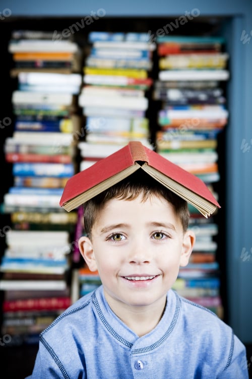 Preview: Little Boy With Book On His Head