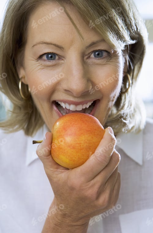Preview: Mature Woman Eating Apple, Close-Up, Front View, Portrait