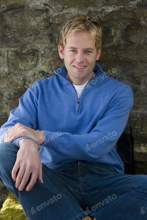 Preview: Smiling Man Leaning Against Stone Wall