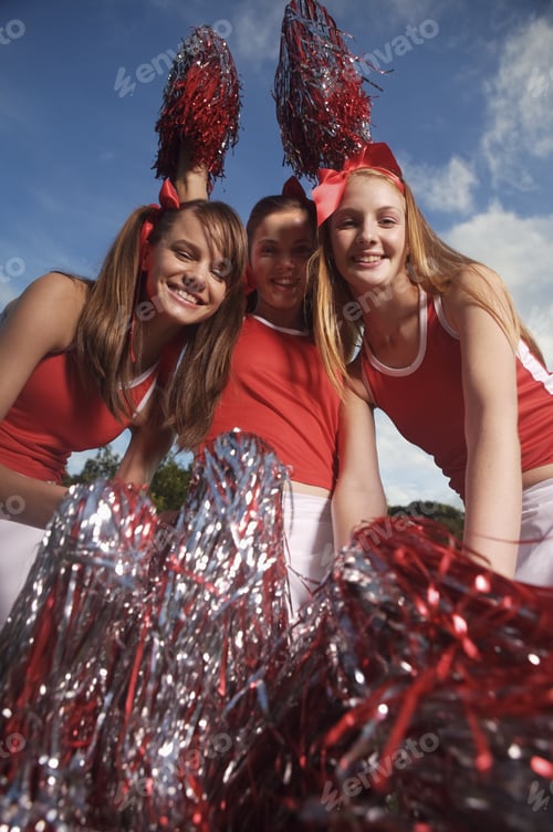 Preview: Portrait Of Three Cheerleaders Cheering