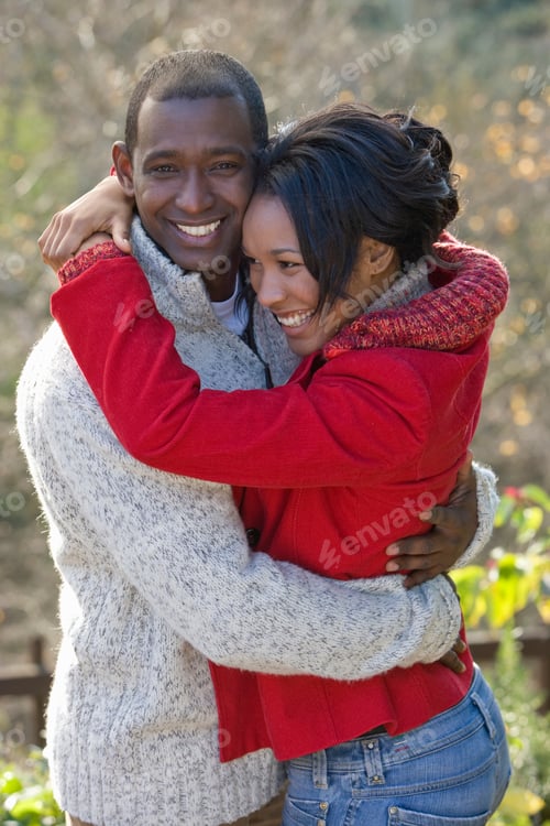 Preview: Loving Couple On Walk In Autumn Countryside Smiling At Camera