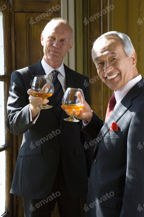Preview: Senior Businessman And Colleague With Drinks, Smiling, Portrait