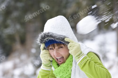 Preview: Shocked Woman Having Snowball Fight In Woods