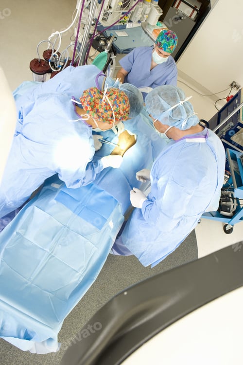Preview: Surgeons Operating On Patient, Elevated View