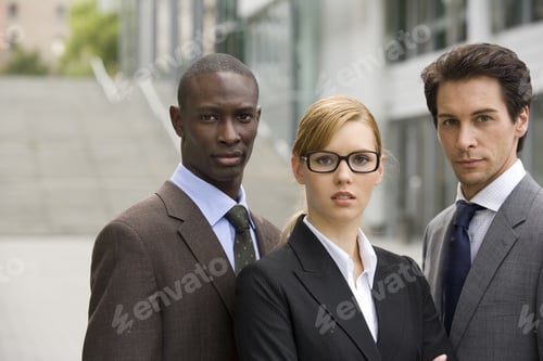 Preview: Three Business People Standing Together.