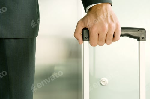 Preview: A Businessman Holding A Suitcase
