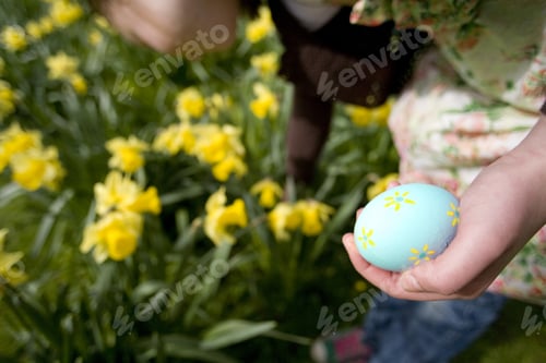 Preview: Young Girl Holding Decorated Easter Egg