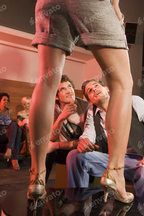 Preview: Men Looking At A Woman.