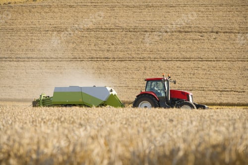 Preview: Tractor And Straw Baler In Sunny, Rural Field
