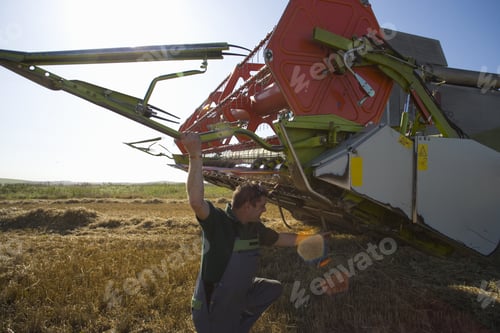 Preview: Farmer Fixing Harvester