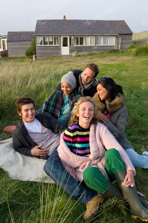 Preview: Young Friends Having Fun Renting House By Sea In Autumn At Camera