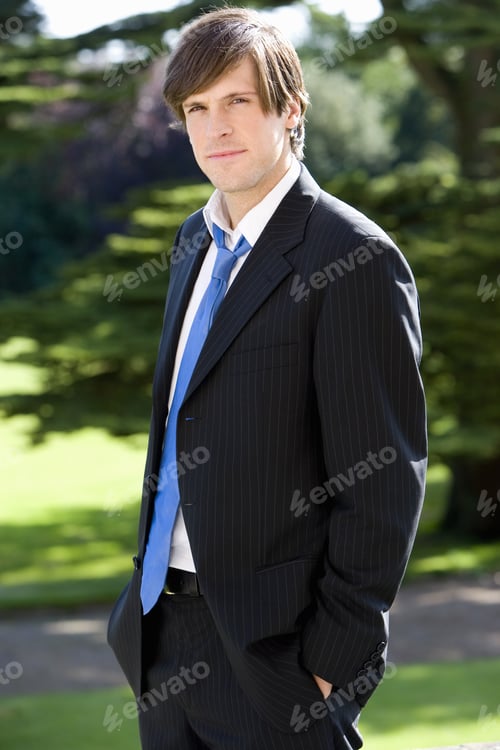 Preview: Young Businessman With Hands In Pockets Outdoors, Smiling, Portrait