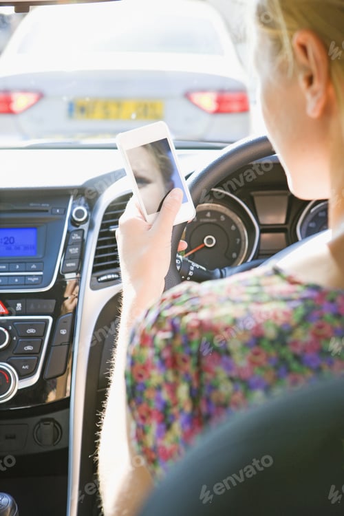 Preview: Female Driver Sending Text Message Whilst Driving