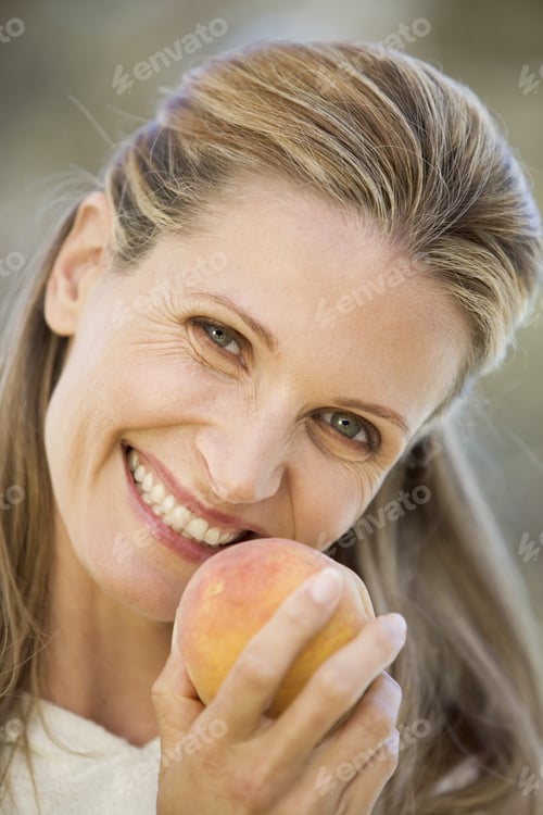 Preview: A Woman Holding A Peach
