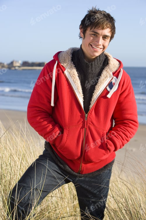 Preview: Smiling Man In Coat On Beach