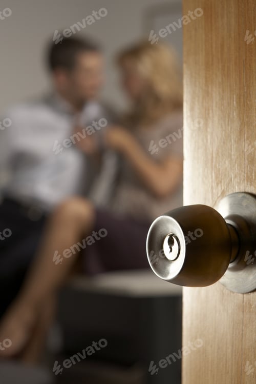 Preview: Close-Up Of A Door Knob, Couple In The Background