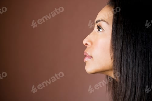 Preview: Studio Portrait Of Beautiful Woman With Long Hair In Profile