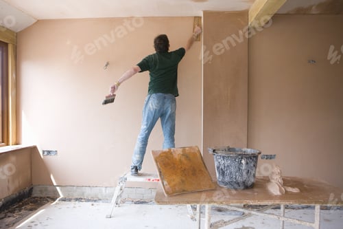 Preview: Interior Work: Adult Plastering Wall in Room