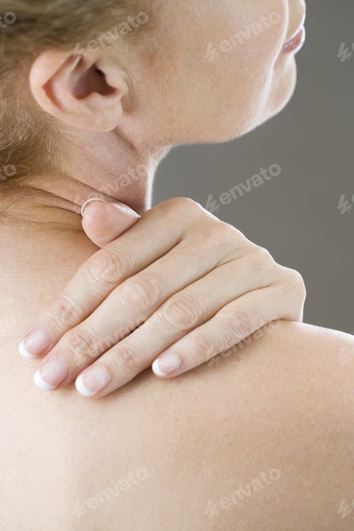 Preview: A Woman With Her Hand On Her Shoulder