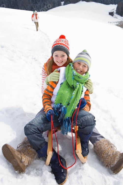 Preview: Children On Winter Vacation Riding On Sled Smiling At Camera
