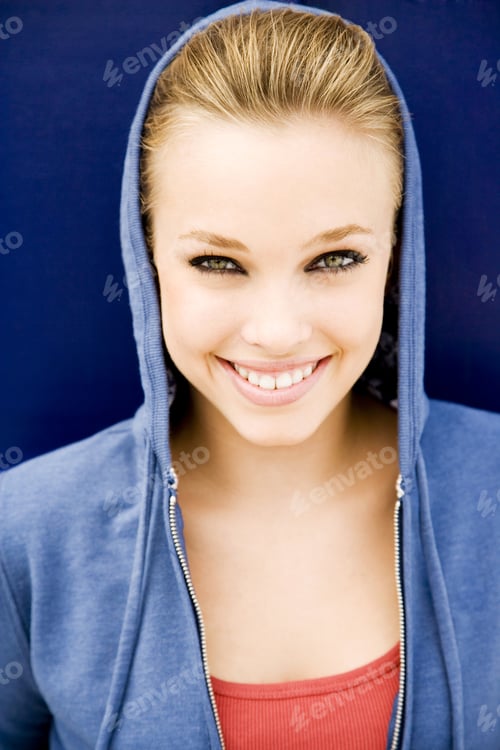 Preview: Portrait Of A Girl Leaning Against A Blue Painted Wall