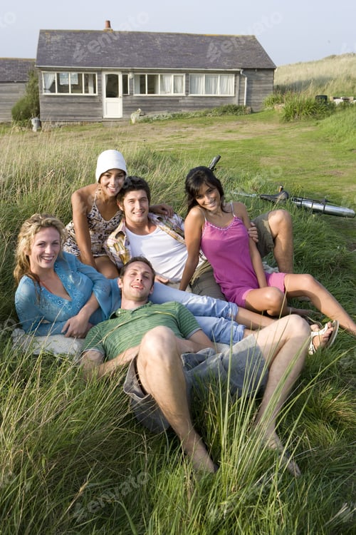 Preview: Portrait Of Young Adults Sitting In Front Of House