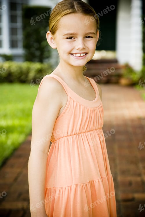 Preview: Little Girl Standing On The Garden Path Outside Her New Home