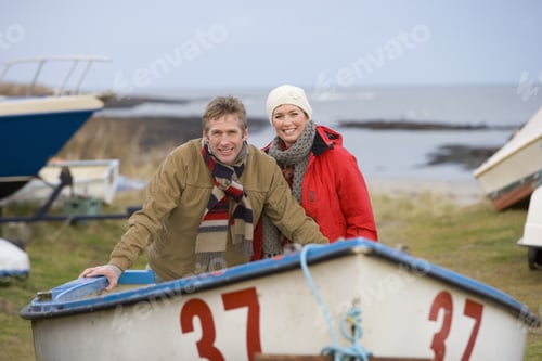 Preview: Husband And Wife Standing In Boat On Beach