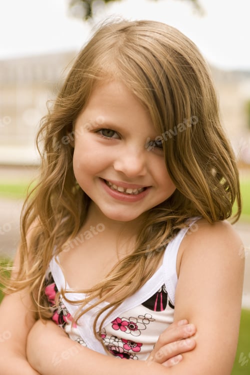 Preview: Portrait Of A Girl Standing With Her Arms Crossed