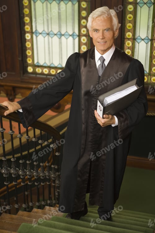 Preview: Portrait Of A Lawyer Moving Up On A Staircase And Smiling