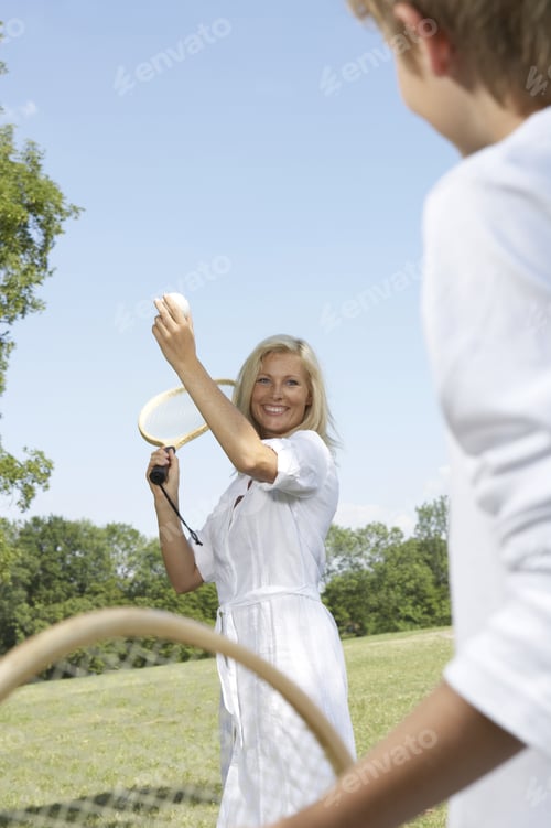 Preview: Woman Playing Tennis With Her Son.